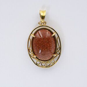 14kt Intricate Framed Goldstone Glass Cabochon Pendant